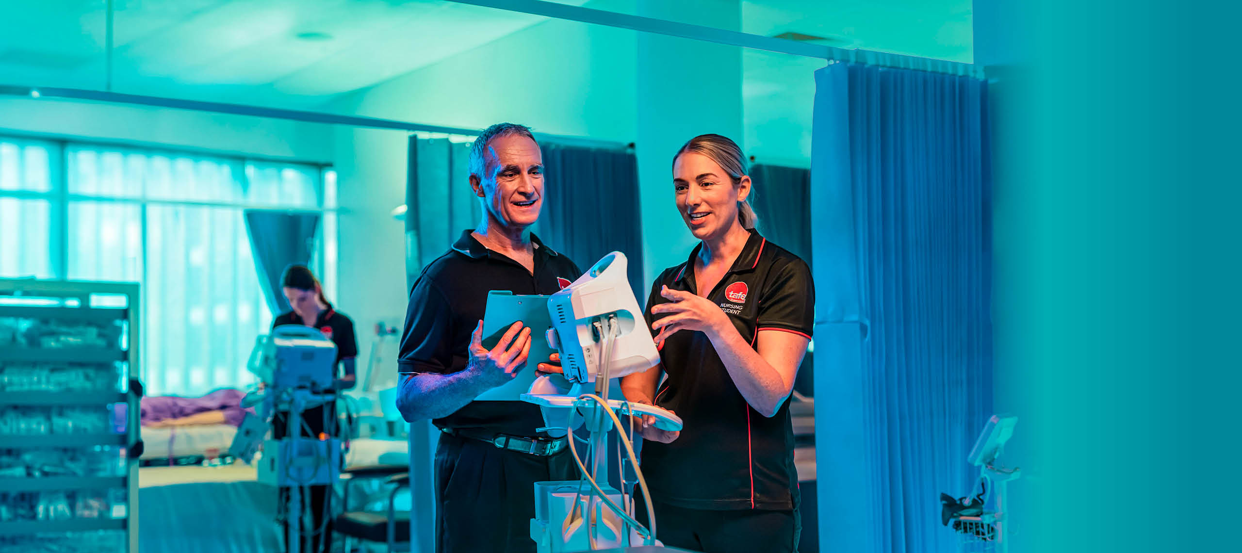 Photograph of a nursing student Zoe Hope working with a hololens heart