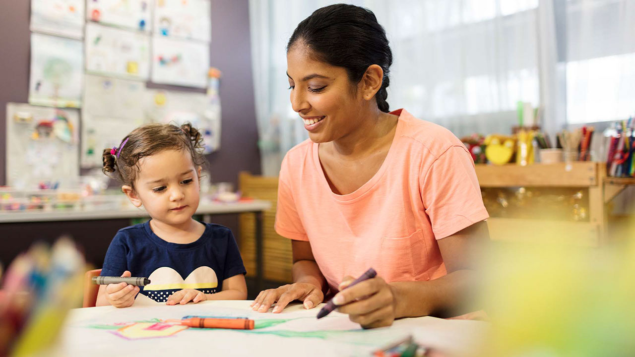 A TAFE Queensland childcare student working with a child
