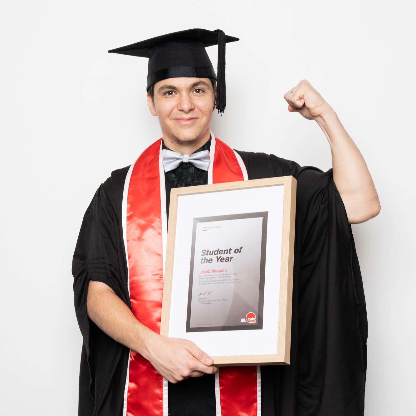 Diploma of Nursing graduate Jakeb Nicolaou with his Student of the Year certificate.